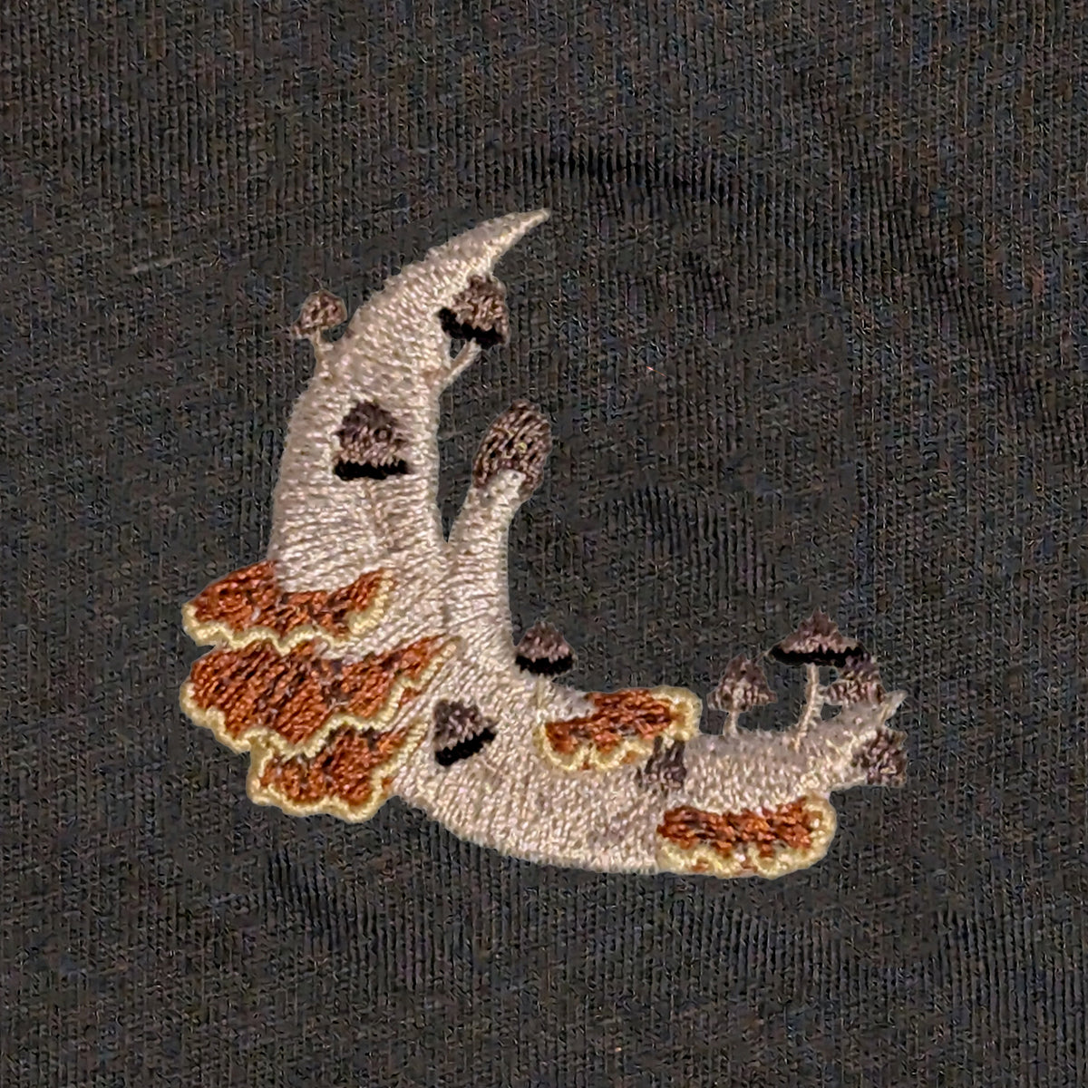 Closeup photo of the Mushroom Moon Crescent embroidery design