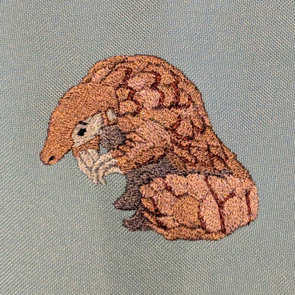 Closeup photo of the Pangolin embroidery design