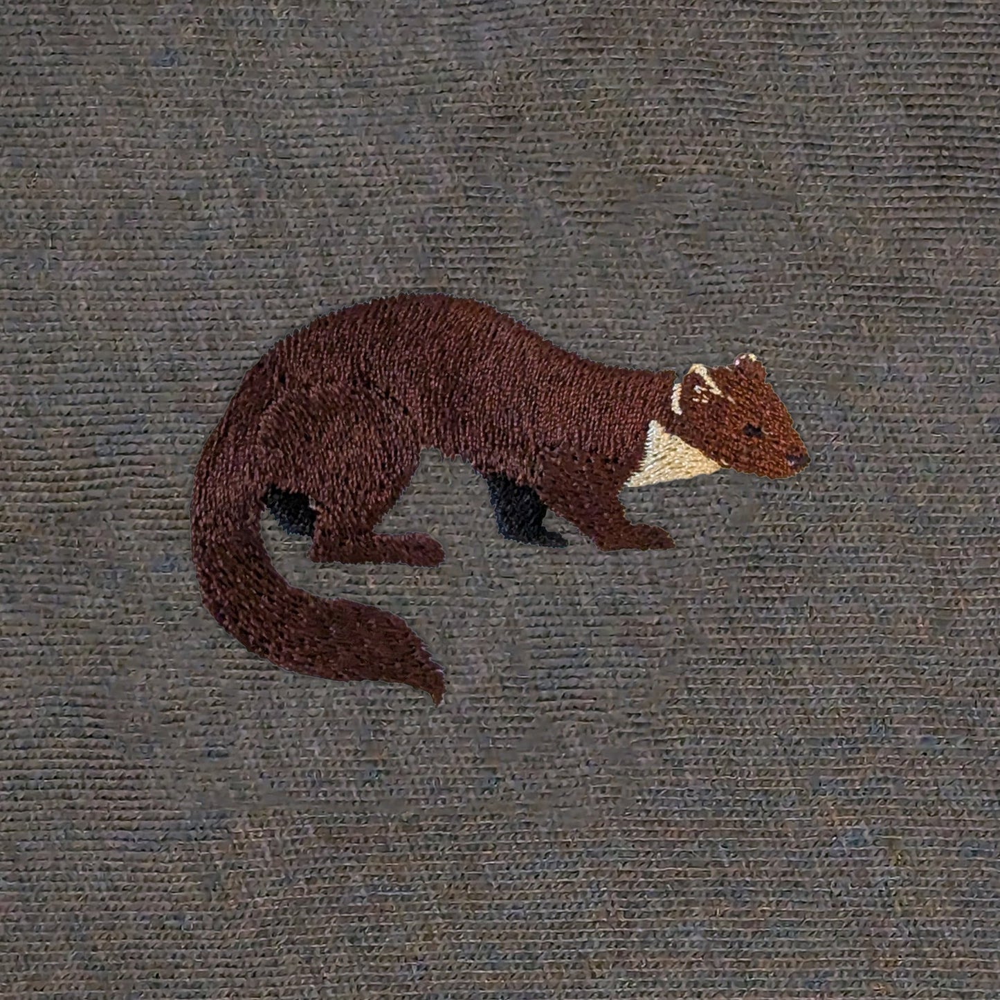 Closeup photo of the Pine Marten embroidery design