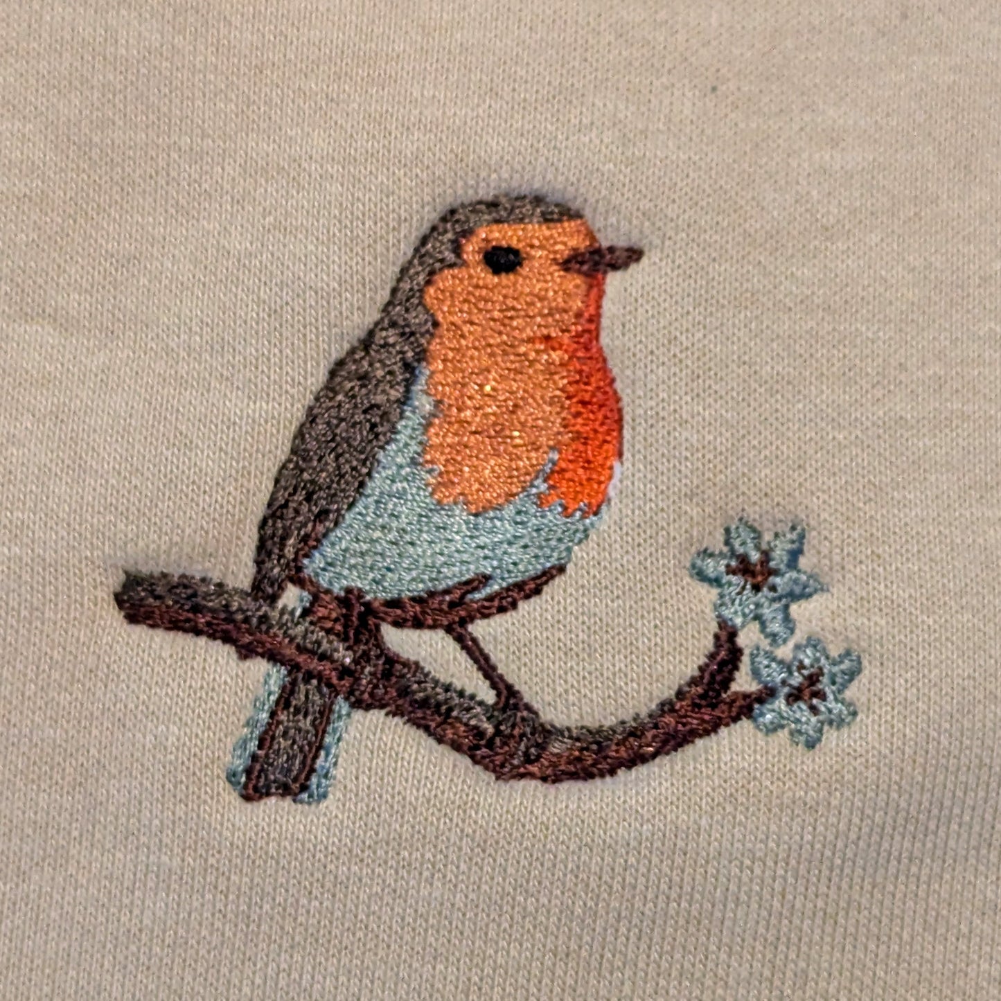 Closeup photo of the Robin embroidery design