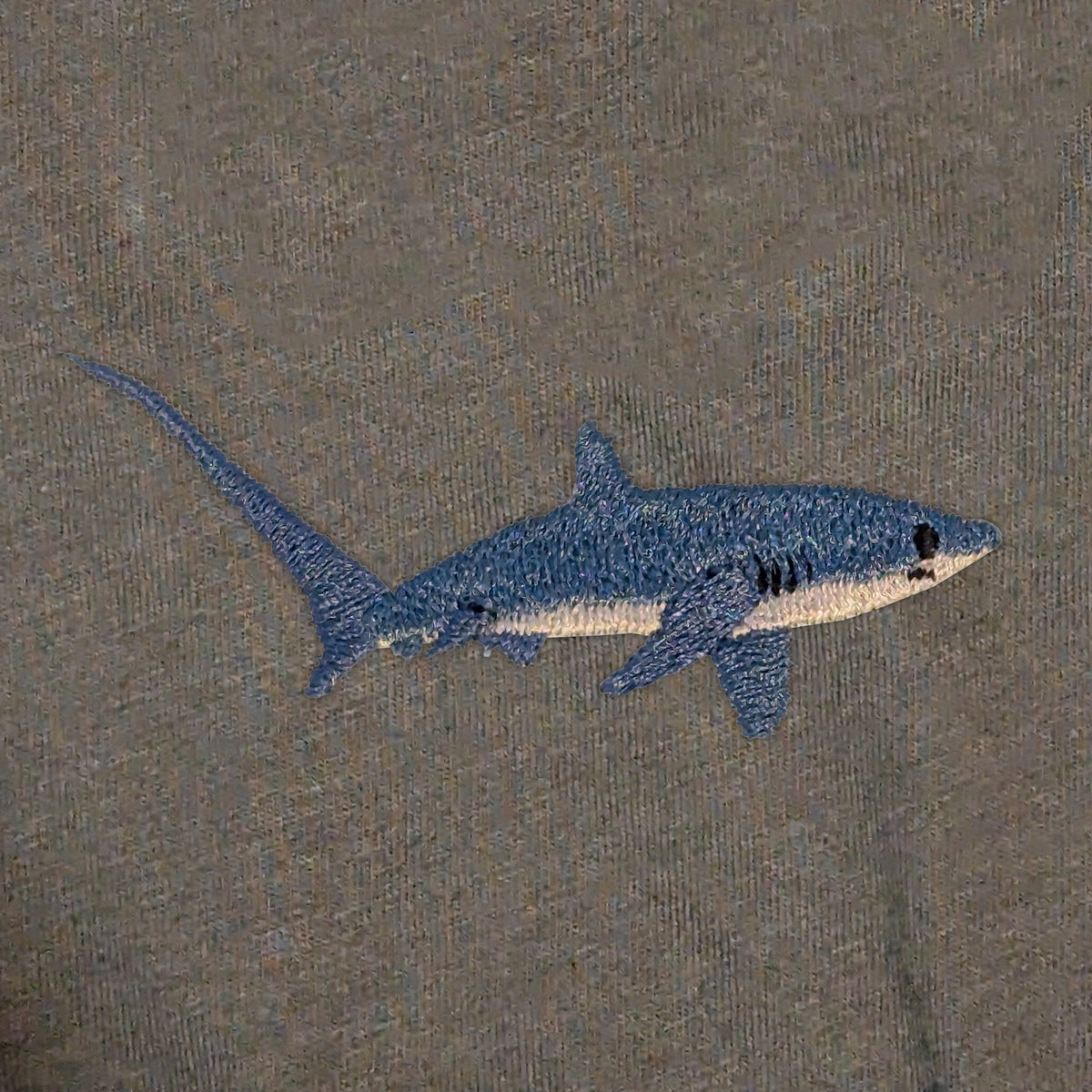 Closeup photo of the Thresher Shark embroidery design